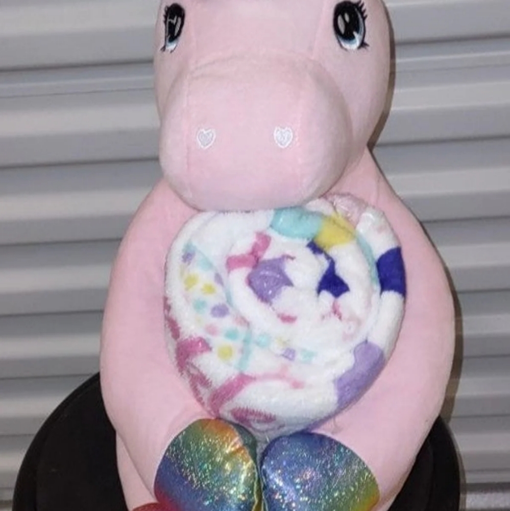 Stuffed animal holding a blanket set